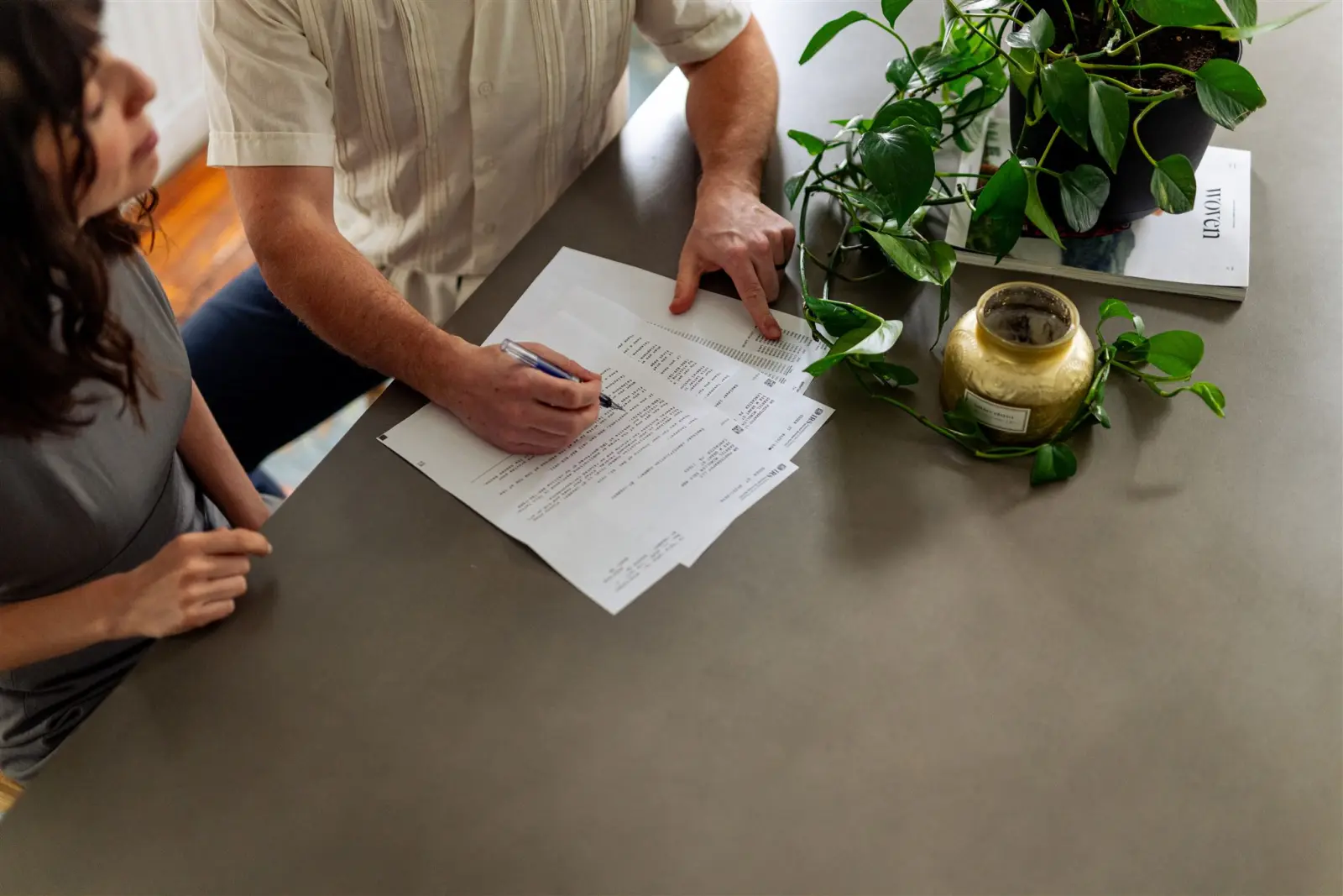 Zac Demi reviewing a client's financial statements